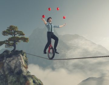 Juggler is balancing on rope with a bike between two mountains. This is a 3d render illustration